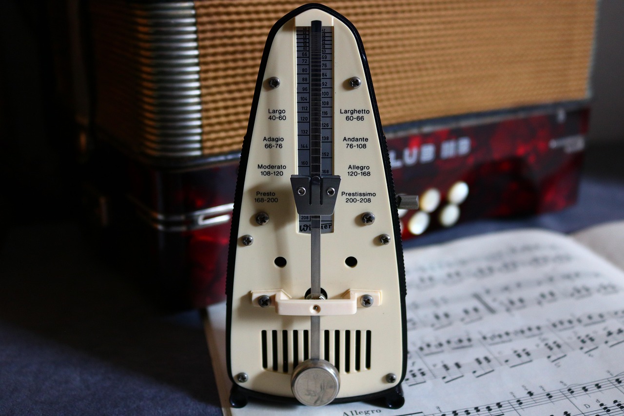 Metronome, sheet music and an accordion