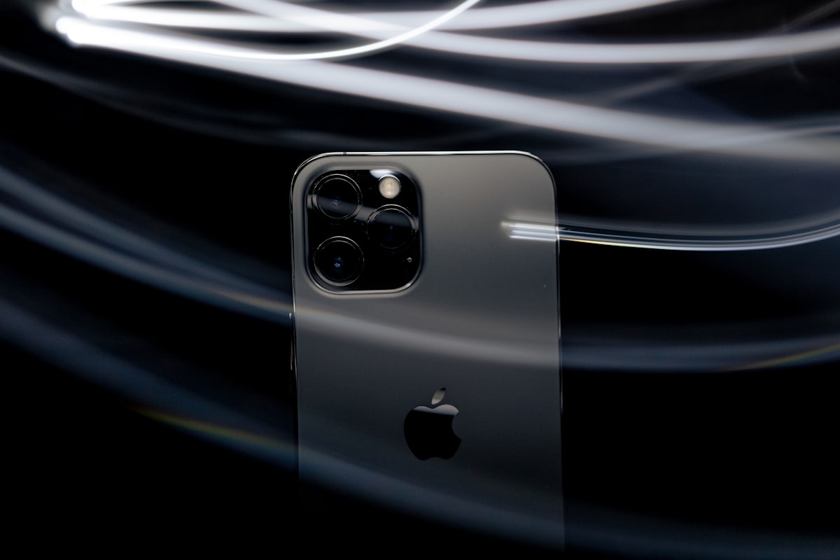 black apple logo with white light